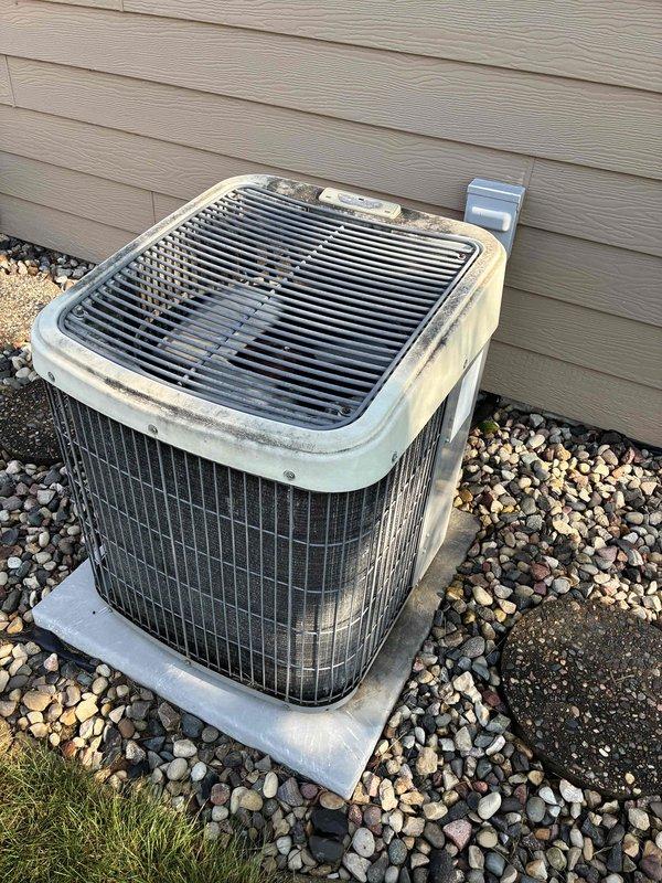 Responded to no cooling complaint on 24-year-old R22 system. Found compressor failing to start at outdoor condenser unit. Discovered and removed mouse nest from condenser, inspected all wiring and confirmed no rodent damage. Attempted multiple starts; compressor eventually engaged but exhibited slow, labored startup indicating internal wear. Tested run capacitor, reading 27.8 µF on 30 µF rated capacitor—slightly low but within acceptable range to start compressor under normal conditions. Explained to homeowner that while capacitor replacement was an option, the compressor's hard-start behavior suggested internal mechanical failure likely due to age, and repair may only provide temporary relief. Discussed system age, obsolete R22 refrigerant, and reliability concerns. Homeowner elected to pursue full system replacement rather than invest in repairs on aging equipment. Scheduled replacement consultation.