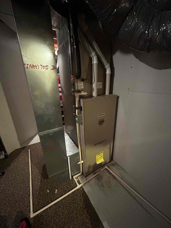 Responded to no cooling complaint on 15-year-old York central air conditioning system with indoor temperature at 78°F. Upon arrival, found evaporator coil completely frozen with severely clogged air filter restricting airflow. Removed plugged filter and left blower running in fan-only mode to thaw frozen coil. Advised homeowner that once coil is fully thawed, system should be restarted to verify proper cooling operation. Informed homeowner that if cooling issues persist after thaw cycle completes, a refrigerant leak or low charge is likely and system replacement should be considered given age of equipment.