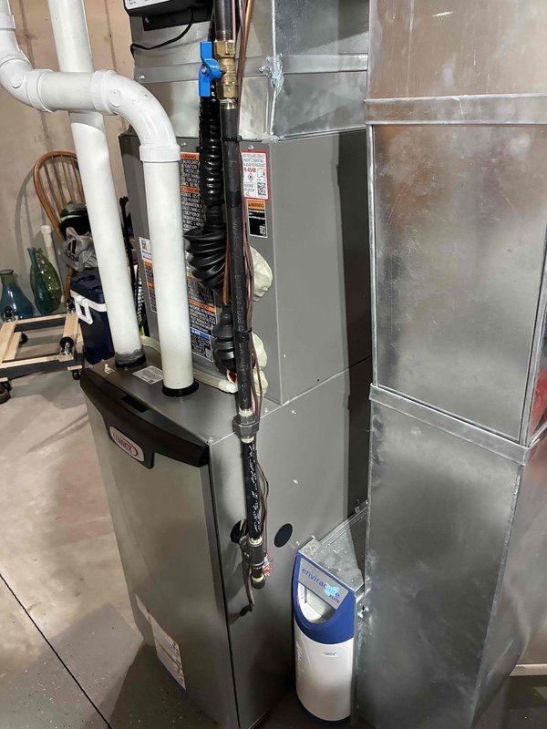 Responded to no cooling complaint on Lennox WT 10-2035 system less than one year old. Homeowner reported loud grinding noise during overnight operation that ceased after power cycling and did not recur. Performed comprehensive system evaluation including multiple start/stop cycles to attempt recreation of reported symptom. Inspected contactor for arcing, pitting, or burn marks on contact points and low voltage connections—all components within normal operating parameters. Unit operated properly throughout service call with normal compressor engagement, proper refrigerant cycling, and no abnormal sounds detected. Unable to diagnose intermittent issue without symptom present. Advised homeowner to monitor system operation and document any future occurrences with video if possible for further diagnostic evaluation.