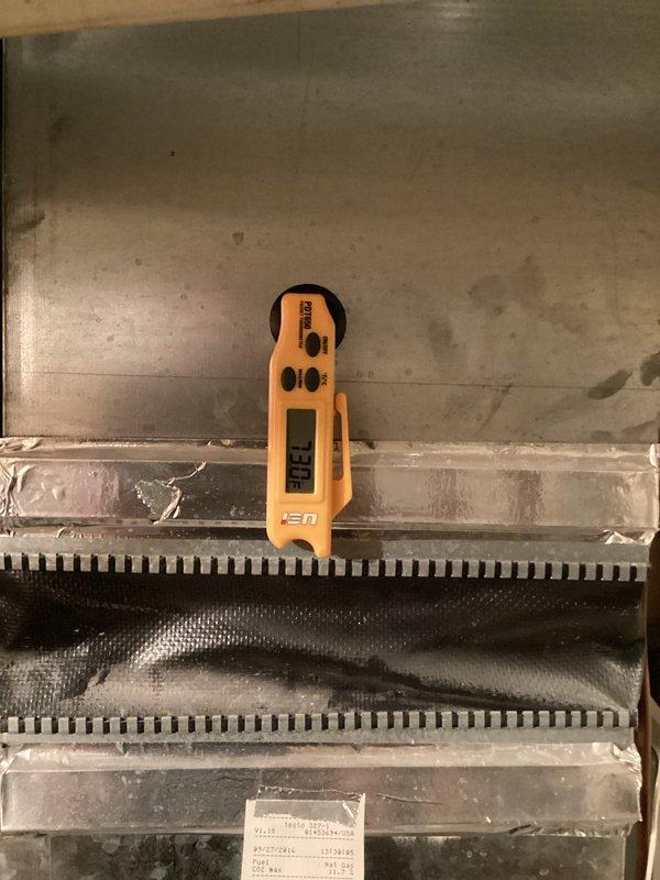 Responded to no-cool complaint on 9-year-old residential air conditioning system unable to maintain setpoint of 73°F, holding at 78°F. Upon arrival, found A/C unit running continuously but providing insufficient cooling to the residence. Performed diagnostic evaluation of system operation and measured temperature differentials across the evaporator coil using digital thermometer.

Inspection revealed evaporator coil exhibiting ice formation, indicating low refrigerant charge. Confirmed system was operating with inadequate refrigerant levels, causing reduced cooling capacity and coil freeze-up. Low charge condition was preventing proper heat absorption and causing compressor to run continuously without achieving desired indoor temperature.

Advised homeowner to power down system for 24 hours to allow complete defrost of evaporator coil before proceeding with refrigerant service. Shut down unit to prevent potential compressor damage from continued operation in frozen condition. Scheduled