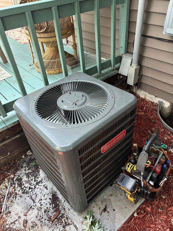 Responded to no cooling call on 2022 Goodman AC unit where customer reported breaker was tripping repeatedly before stopping. Upon arrival, discovered no high voltage power to contactor and determined only one leg of power present from breaker panel to outdoor disconnect. Performed ohm checks on compressor and fan motor, confirming both components tested within normal range with no shorts detected. Diagnosed faulty breaker in main electrical panel as root cause of power loss. Recommended electrical service to replace defective breaker; customer elected to perform repair himself.