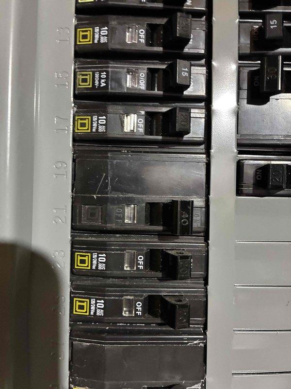 Responded to no cooling call on 2022 Goodman AC unit where customer reported breaker was tripping repeatedly before stopping. Upon arrival, discovered no high voltage power to contactor and determined only one leg of power present from breaker panel to outdoor disconnect. Performed ohm checks on compressor and fan motor, confirming both components tested within normal range with no shorts detected. Diagnosed faulty breaker in main electrical panel as root cause of power loss. Recommended electrical service to replace defective breaker; customer elected to perform repair himself.