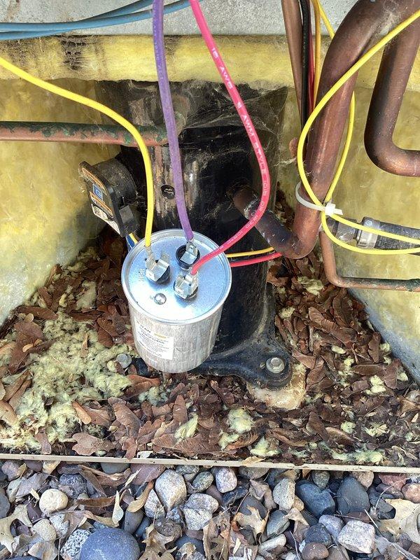 Responded to no cooling complaint on residential air conditioning system. Upon arrival, found unit shut down on high pressure safety. Diagnosed failed run capacitor and replaced with new component. During testing, observed oil residue on pressure switch indicating potential refrigerant leak. System pressure check confirmed unit was low on refrigerant charge. Provided estimate to customer for refrigerant recharge and system restoration.