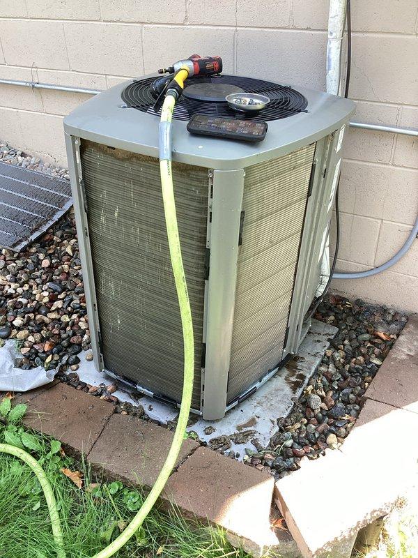 Performed comprehensive AC tune-up on 4-year-old Lennox system. Disassembled outdoor condenser unit, thoroughly cleaned accumulated dirt and debris from internal components, coils, and fan assembly. Reassembled unit and verified system is operating properly with adequate cooling performance.