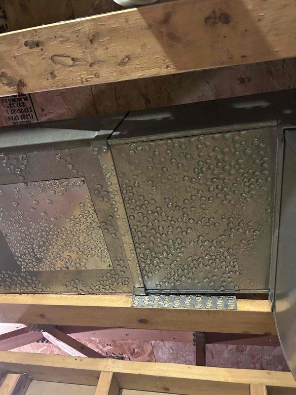 Responded to no cooling complaint on 10+ year old system. Upon arrival, found unit had previously frozen due to severely restricted airflow from extremely dirty air filter. Customer had replaced filter and allowed coil to thaw, but system still showed reduced cooling capacity with only 14-15°F temperature split. Outdoor unit coil was heavily clogged with debris, restricting airflow and reducing heat rejection capacity. Thoroughly cleaned and rinsed outdoor coil to restore proper airflow. Connected manifold gauges and verified refrigerant pressures within acceptable range. Inspected evaporator coil and confirmed proper refrigerant distribution with uniform sweating pattern across entire coil surface. System operational at time of departure with improved airflow through both indoor and outdoor coils. Advised customer on importance of regular filter maintenance to prevent future freezing issues.