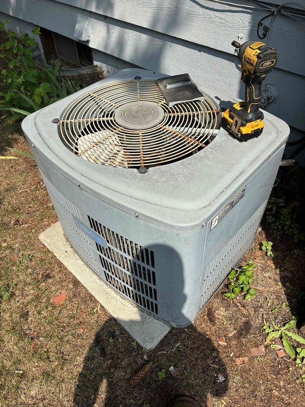 Responded to no cooling complaint on 25-year-old R-22 air conditioning system. Upon arrival, found compressor and condenser fan motor excessively hot to touch, with fan motor nearly smoking and not operating. Diagnostics revealed failed dual run capacitor and severely restricted condenser coil due to debris accumulation. Discussed findings with homeowner, explaining that while capacitor replacement and coil cleaning could be performed, the extreme overheating of both motors significantly compromised their reliability and longevity. Given the system's age, refrigerant type, and condition of major components, homeowner elected to pursue replacement options. Coordinated comfort advisor appointment for same day to discuss system replacement solutions.