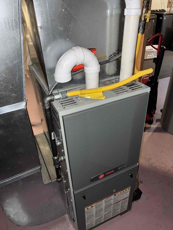 Responded to no cooling complaint on residential Trane system. Upon inspection, determined compressor was not starting due to failed capacitor. Replaced defective capacitor and verified proper compressor operation. Checked condenser coil and air filter, both found clean. Confirmed condensate drain line clear and flowing properly. Measured 18-degree temperature differential across evaporator coil, confirming system restored to proper cooling operation.