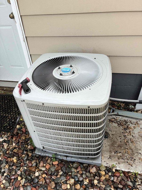 Responded to no cooling complaint on residential Trane system. Upon inspection, determined compressor was not starting due to failed capacitor. Replaced defective capacitor and verified proper compressor operation. Checked condenser coil and air filter, both found clean. Confirmed condensate drain line clear and flowing properly. Measured 18-degree temperature differential across evaporator coil, confirming system restored to proper cooling operation.
