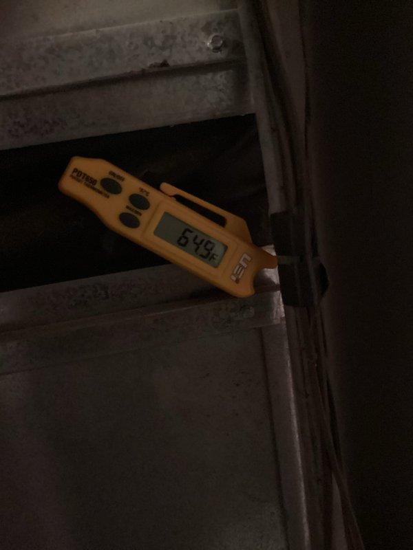 Responded to no-cooling call at duplex property. Upon inspection, found 15-year-old central air conditioning system completely non-operational. Outdoor condensing unit exhibited severe neglect with heavily corroded electrical connections, deteriorated wiring, and substantial accumulation of dirt and debris throughout the unit. 

Diagnostic testing revealed failed run capacitor preventing compressor and condenser fan operation. Electrical terminal housing showed extensive oxidation and weather damage from prolonged exposure to elements. Multiple wire connections displayed corrosion requiring attention during capacitor replacement.

Replaced defective capacitor with properly rated component. Performed thorough cleaning of condensing unit, removing accumulated dirt, debris, and vegetation matter from coils and electrical compartment. Cleaned and secured all electrical connections in terminal area. Cleared surrounding vegetation encroaching on unit for proper airflow.

System tested succes