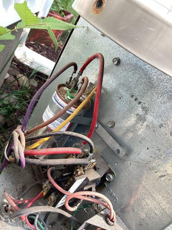 Responded to no cooling complaint on 15-year-old R22 central air conditioning system with indoor temperature reading 82-84°F. Upon inspection, found failed capacitor and loose wire connection at outdoor unit, both of which were repaired to restore operation. Diagnostic testing revealed refrigerant flooding in evaporator coil indicating system inefficiencies consistent with age-related component degradation. Unit restored to operational status with cooling capability, however customer advised of underlying system issues due to age and R22 refrigerant phase-out. Scheduled follow-up appointment to provide replacement system estimate given the advanced age of equipment and declining efficiency.