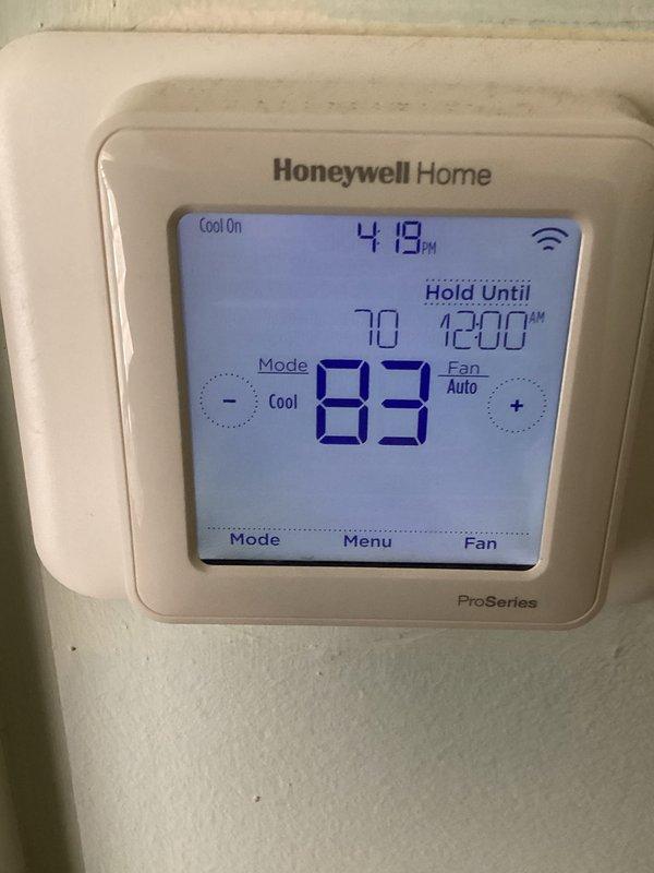 Responded to no cooling complaint on 15-year-old R22 central air conditioning system with indoor temperature reading 82-84°F. Upon inspection, found failed capacitor and loose wire connection at outdoor unit, both of which were repaired to restore operation. Diagnostic testing revealed refrigerant flooding in evaporator coil indicating system inefficiencies consistent with age-related component degradation. Unit restored to operational status with cooling capability, however customer advised of underlying system issues due to age and R22 refrigerant phase-out. Scheduled follow-up appointment to provide replacement system estimate given the advanced age of equipment and declining efficiency.