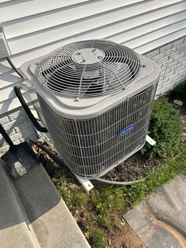 Responded to no cooling complaint on 7-year-old Carrier central air conditioning system. Upon inspection, identified failed capacitor as root cause of system malfunction. Removed defective capacitor and installed new replacement capacitor. System startup and operational testing confirmed proper function with 20-degree temperature split across evaporator coil, indicating adequate cooling performance restored.
