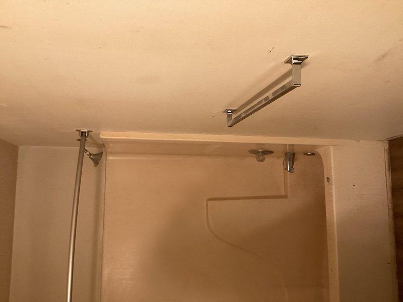 Installed two chrome-finished safety grab bars in residential shower enclosure to improve accessibility and prevent falls. Bars were securely mounted to wall studs per ADA guidelines, with one horizontal bar positioned along the tub entry point and proper placement verified for optimal support during entry, exit, and showering activities.