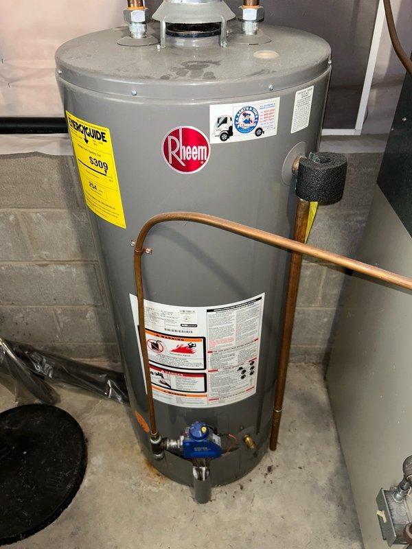 Responded to no cool call on 30-year-old A/C system with water condensation buildup in drain pan. Inspected air filter (satisfactory), evaporator coil, and drainage system (clear). Heat exchanger inspection revealed cracks and significant rust accumulation. Outdoor unit evaluation identified low refrigerant charge. Cleaned condenser coils and verified electrical components operational. System currently running with undercharge; advised homeowner of potential ice buildup recurrence and system age-related concerns requiring future attention.