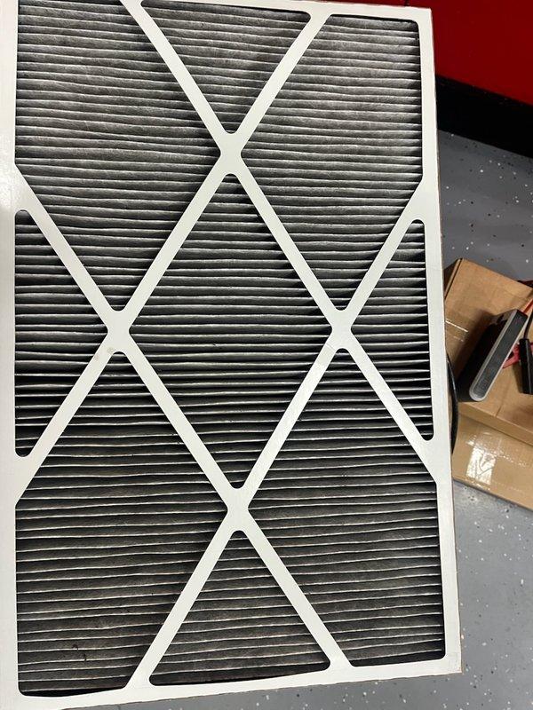 Responded to service call for excessive condensation on ductwork, venting system, and AC supply vents with unit running continuously. Upon inspection, found high indoor humidity levels and system operating with 64°F return air and 44°F supply air temperatures. Diagnostic testing revealed refrigerant charge was low at only 6° subcooling. Adjusted refrigerant charge to manufacturer specifications and increased cooling airflow by 10% via dip switch adjustment to address condensation issues. Verified air filter was clean and airflow was within proper range. Advised homeowner to operate dehumidifier continuously and run system fan constantly to reduce indoor humidity levels and prevent further condensation on supply vents and ductwork. System operating properly at conclusion of service with improved subcooling and airflow parameters.