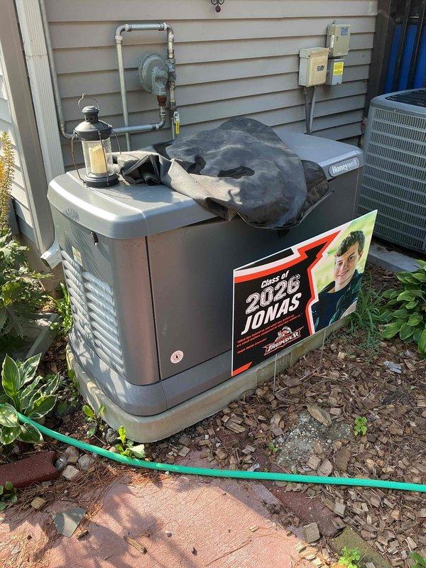 Completed scheduled tune-up and maintenance on 2-year-old Generac residential standby generator. Upon arrival, found unit displaying error code 2800 indicating auxiliary shutoff switch had been activated. Diagnosed that external shutoff switch on backside of unit had been inadvertently flipped, causing offline status and triggering maintenance alert emails. Reset auxiliary switch and cleared error code from system. Performed complete maintenance service including oil change, spark plug replacement, air filter replacement, and oil filter replacement. Reset maintenance notification timer and restored unit to full operational status. Provided customer education on location of external shutoff switches and demonstrated proper reset procedure to prevent future accidental activation.