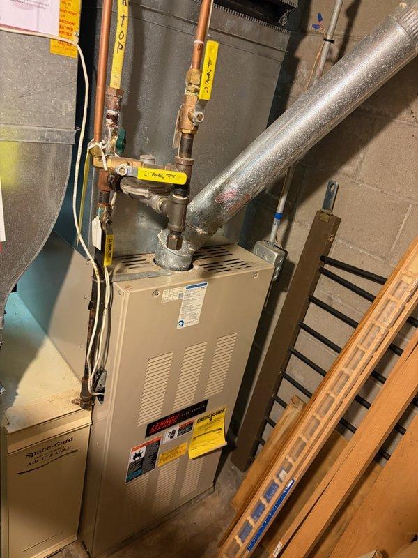 Responded to no-cool call on 20-year-old residential central air conditioning system. Upon arrival, confirmed outdoor condensing unit would not start. Performed diagnostic testing and identified failed capacitor preventing compressor and condenser fan motor operation. Replaced defective capacitor with properly-rated component, verified system startup, and confirmed normal cooling operation restored.
