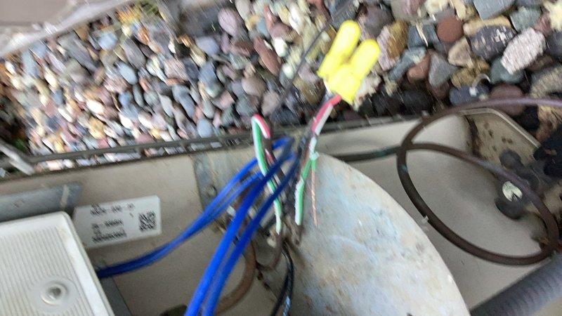 Responded to a no cooling call for a ground-level air conditioning unit. Upon inspection, discovered rodent-damaged wiring and a blown capacitor in the condenser. Replaced the failed capacitor, repaired all damaged wiring connections, and cycled the system to verify proper operation. Checked refrigerant levels, indoor blower, and air filter. System restored to normal operation.