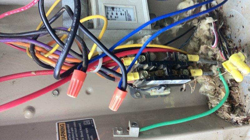 Responded to a no cooling call for a ground-level air conditioning unit. Upon inspection, discovered rodent-damaged wiring and a blown capacitor in the condenser. Replaced the failed capacitor, repaired all damaged wiring connections, and cycled the system to verify proper operation. Checked refrigerant levels, indoor blower, and air filter. System restored to normal operation.