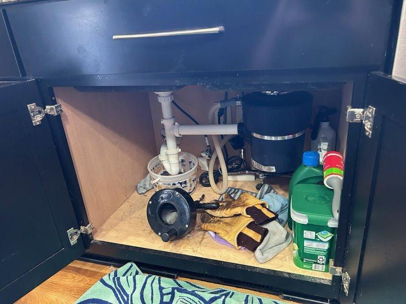 Responded to a kitchen sink stoppage that remained clogged despite homeowner's attempts to clear with hand snake and power auger. Upon diagnostic assessment, determined the blockage was most likely caused by food debris accumulation and significant scale buildup on the interior pipe walls. Utilized flex shaft machine in combination with branch line camera to effectively clear the obstruction and remove accumulated scale deposits from the drain line. Ran water continuously during the cabling process to flush away loosened debris and ensure complete clearance. After clearing the blockage, performed verification testing by filling and draining the kitchen sink multiple times to confirm proper drainage flow and inspected all connections for leaks, with no issues detected upon completion.
