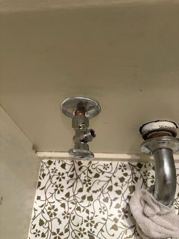 Responded to a callback for a persistent toilet leak reported after previous service visit. Upon arrival, inspected the hot side angle stop on the basement lavatory faucet as indicated by homeowner. Tightened the compression nut on the angle stop to seal the leak. Monitored the valve for ten minutes to confirm no active leaking was present. Left valve in service with no leaks detected at time of departure.