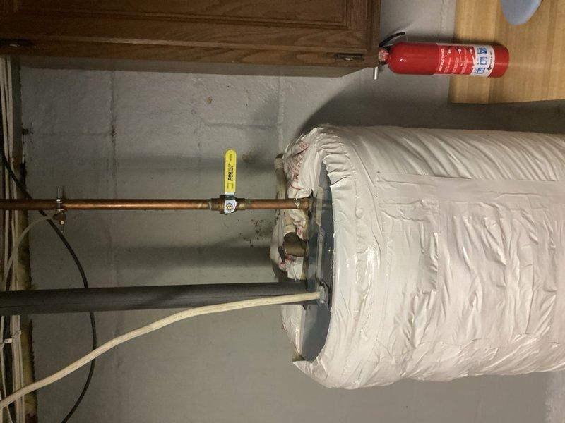 Responded to service call for 10+ year old 50-gallon electric water heater actively seeping from the bottom. Assessed unit and discussed replacement options with customer, including tankless gas and electric alternatives with various venting configurations. Customer elected to proceed with like-for-like replacement. Removed and disposed of failed electric water heater, installed new 50-gallon electric unit with proper connections to existing copper supply lines and electrical service, verified all connections for leaks, tested operation, and restored hot water service to the residence.