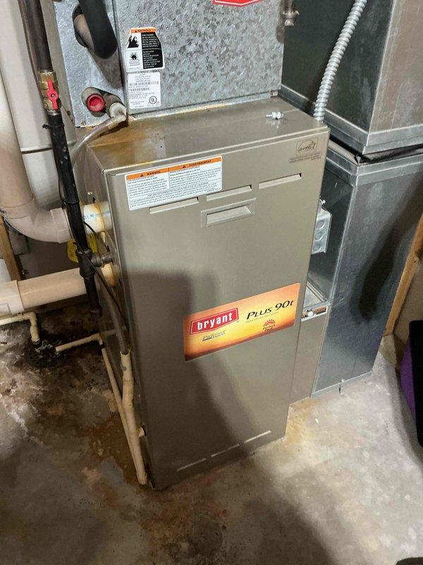Performed air conditioning tune-up on 22-year-old residential system. Found clogged evaporator drain pan and capacitor reading out of specification. Replaced failed capacitor and removed debris from drain pan to restore proper drainage. Observed significant corrosion and rust on evaporator coil and metal housing components, indicating advanced equipment deterioration. Recommended system replacement due to age and extent of corrosion compromising unit integrity and efficiency.