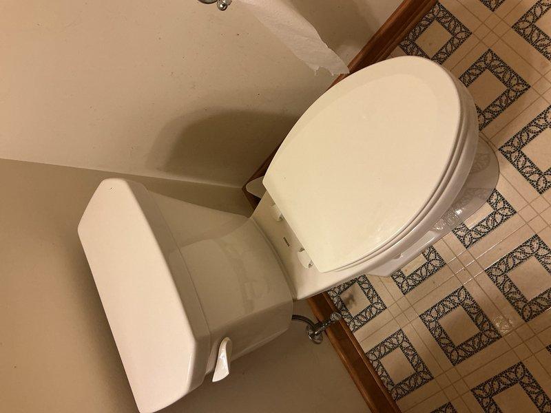 Responded to report of toilet leaking extensively in residential bathroom. Upon assessment, determined that existing toilet had developed persistent leak requiring full replacement rather than repair. Removed old two-piece toilet fixture, including disconnecting water supply line and unbolting from floor flange. Inspected flange and subfloor for water damage; confirmed structural integrity. Installed new ADA-compliant toilet to meet customer's accessibility requirements and height preferences. Secured new fixture to flange with brass closet bolts, installed new wax ring seal, and reconnected chrome water supply line. Tested for proper function and verified no leaks at base or supply connection. Left work area clean with all old materials removed from premises.