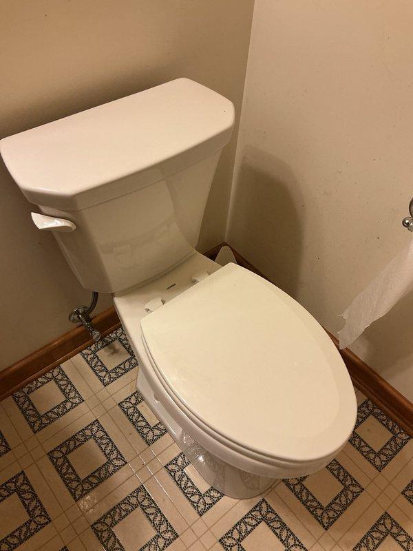 Responded to report of toilet leaking extensively in residential bathroom. Upon assessment, determined that existing toilet had developed persistent leak requiring full replacement rather than repair. Removed old two-piece toilet fixture, including disconnecting water supply line and unbolting from floor flange. Inspected flange and subfloor for water damage; confirmed structural integrity. Installed new ADA-compliant toilet to meet customer's accessibility requirements and height preferences. Secured new fixture to flange with brass closet bolts, installed new wax ring seal, and reconnected chrome water supply line. Tested for proper function and verified no leaks at base or supply connection. Left work area clean with all old materials removed from premises.