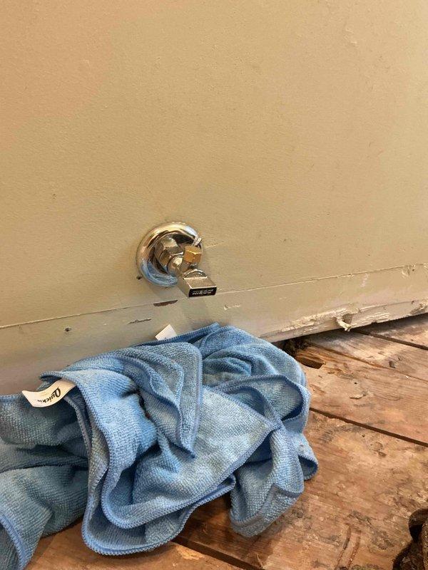 Responded to emergency call from restoration company for active water leak at angle stop valve. Upon arrival, located source of leak at chrome angle stop protruding from bathroom wall. Immediately shut off water supply to stop active leaking and prevent further water damage. Successfully repaired the faulty shut-off valve, restoring proper function and eliminating the leak. Verified repair integrity and confirmed no additional water seepage before completing service.