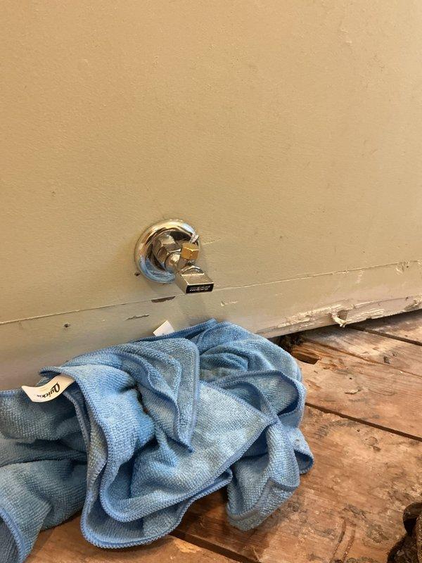 Responded to emergency call from restoration company for active water leak at angle stop valve. Upon arrival, located source of leak at chrome angle stop protruding from bathroom wall. Immediately shut off water supply to stop active leaking and prevent further water damage. Successfully repaired the faulty shut-off valve, restoring proper function and eliminating the leak. Verified repair integrity and confirmed no additional water seepage before completing service.
