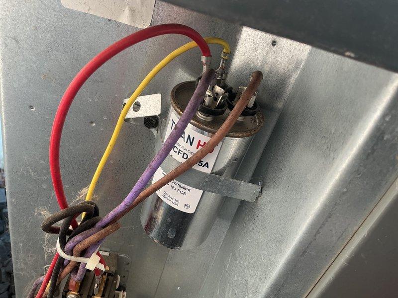 Responded to no cooling complaint on 8-year-old air conditioning system with condenser unit not operating. Upon arrival, found system breakers in off position. Reset breakers and restored power to unit, resulting in immediate system operation. Performed comprehensive system diagnostics including capacitor inspection, electrical connections verification, and refrigerant charge evaluation. Measured temperature split at supply and return registers, confirming proper system performance at 16 degrees. Inspected air filter and outdoor condenser coil, both found in clean condition. All components including compressor, condenser fan motor, and contactors tested within manufacturer specifications. System likely experienced thermal lockout due to extended runtime during extreme heat conditions. Confirmed full system functionality with proper cooling operation restored.