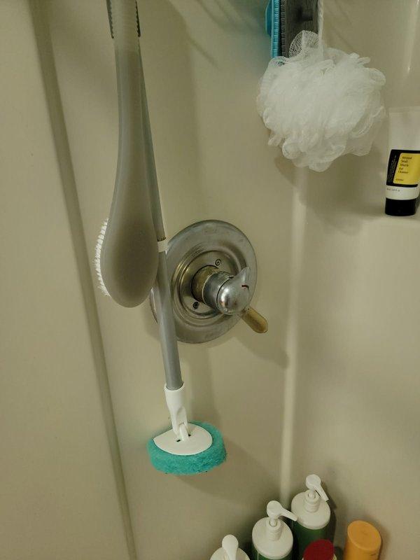 Inspected shower fixtures for reported dripping showerhead and worn on/off selectors. Evaluated existing chrome trim kits and valve cartridges in dual-control shower system, noting deterioration of control mechanisms. Provided estimate for replacement of trim kits and cartridges for both shower controls to resolve leaking and restore proper operation.