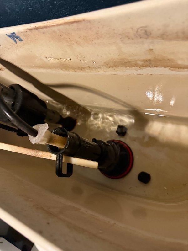 Responded to a continuously running toilet that would get stuck after flushing. Upon inspection, identified a broken trip lever stop on the fill valve preventing proper shutoff. Replaced the damaged trip lever stop and installed a new flush valve gasket to ensure proper sealing and operation. Tested the flush mechanism to verify the toilet now cycles correctly without continuous running.