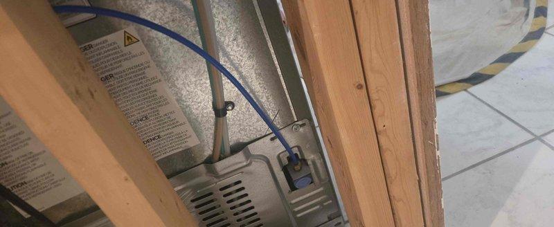 Completed repair of water supply line to refrigerator. Accessed connection point through attic space, inspected existing copper supply line and compression fittings, and performed necessary repairs to restore proper water flow to the appliance ice maker and dispenser system.