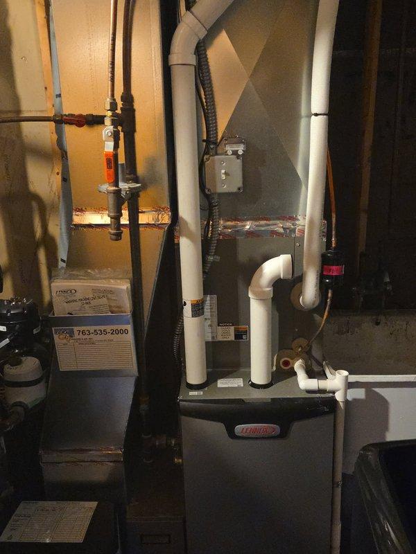 Responded to complaint of loud humming noise from furnace blower motor on 7-year-old Lennox HVAC system. Upon arrival, performed diagnostic inspection of furnace and blower assembly. System was operating normally with no loss of cooling function at time of service call. Attempted to duplicate reported noise condition but was unable to replicate the issue during the service window. Verified blower motor operation, checked electrical connections, and inspected belt and bearing assemblies for signs of wear or mechanical failure. All components appeared to be functioning within normal parameters during testing. Advised customer that intermittent noises can be difficult to diagnose without witnessing the condition firsthand. Recommended customer capture video and audio recording of the noise when it occurs to aid in future diagnosis. System left in operational condition with no immediate safety concerns identified.