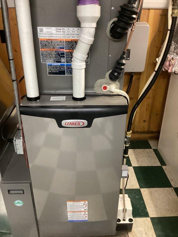 Performed water treatment system maintenance including UV bulb and filter service. Installed customer-supplied UV bulb into existing chrome cylindrical UV filtration unit mounted on wall alongside white filter housing with blue cartridge. Submitted parts request for additional filters per customer's request for future replacement.