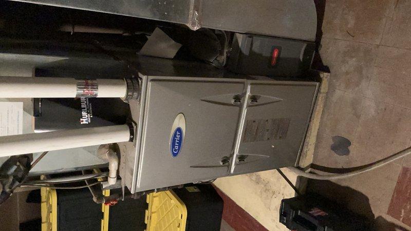 Performed comprehensive furnace and air conditioning system inspection for residential property sale compliance. Conducted thorough evaluation of 11-year-old Carrier HVAC system including both heating and cooling components.

**Furnace Inspection:**
Inspected burner assembly and confirmed proper operation with clean flame pattern. Verified flame sensor functionality and proper signal strength. Evaluated blower motor operation and confirmed adequate airflow throughout system. Performed combustion analysis with digital analyzer, recording carbon monoxide levels at 20 ppm (within acceptable range), oxygen at 10%, carbon dioxide at 5.9%, and steady state efficiency at 98%. All combustion parameters met manufacturer specifications and safety standards. Confirmed proper furnace operation through complete heating cycle.

**Air Conditioning Inspection:**
Evaluated outdoor condensing unit components and electrical systems. Tested run capacitor with digital meter, measuring 32.9 microfarads agai