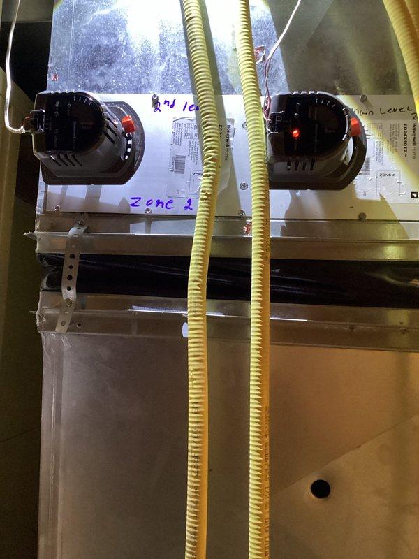 Responded to service call for malfunctioning second floor zone damper in residential HVAC system. Successfully removed and replaced defective zone damper assembly with new unit. Work completed under parts and labor warranty coverage. System tested and verified proper zone operation upon completion.