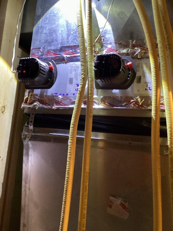 Responded to service call for malfunctioning second floor zone damper in residential HVAC system. Successfully removed and replaced defective zone damper assembly with new unit. Work completed under parts and labor warranty coverage. System tested and verified proper zone operation upon completion.