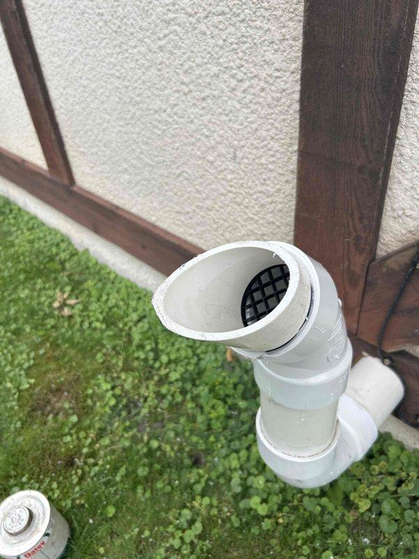 Returned to property to install bird screen on boiler vent termination as preventative measure against pest intrusion. Successfully installed black mesh screening over white PVC vent pipe protruding from exterior wall, securing protection at the termination point to prevent birds and debris from entering the venting system while maintaining proper airflow and combustion air requirements.