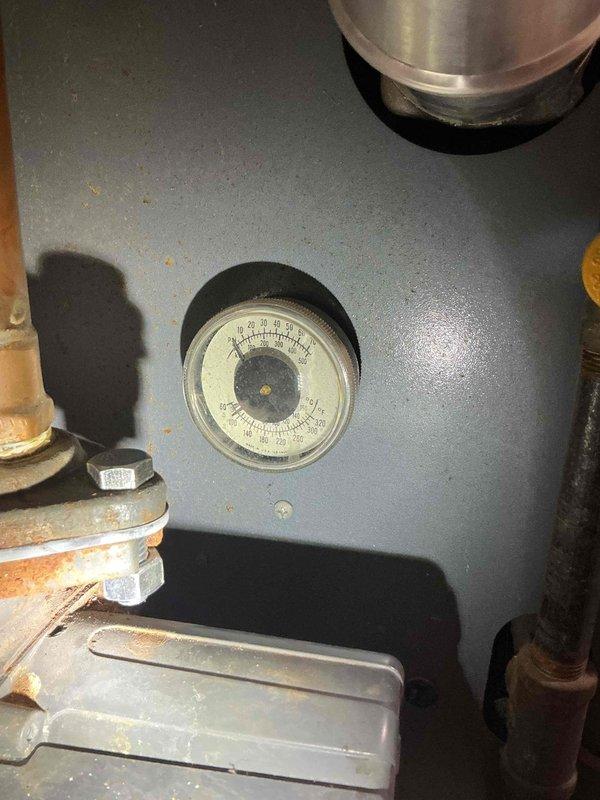 Performed comprehensive pre-sale inspection on 30+ year old Weil McLain boiler system. Found system low on water with circulator pump exhibiting cavitation sounds due to low water condition. Identified slow leak at air separator and evidence of water leak on heat exchanger exterior. Conducted combustion analysis which confirmed safe burning operation with proper gas-to-air mixture. Verified heat exchanger seals are maintaining integrity and containing combustion gases without spillage. Tested and confirmed backflow preventer, expansion tank, and system controls are functioning within acceptable parameters. Documented copper piping deterioration above unit showing oxidation and corrosion with active leak causing rust formation on boiler exterior. Completed certification letter detailing system condition and safety status for real estate transaction.