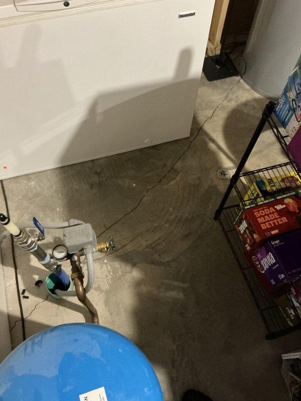 Responded to reported water leak in master shower dripping into basement mechanical room. Upon arrival, area had been dried and no active leak was visible. Conducted diagnostic testing by running shower for 20 minutes to attempt replication of leak condition. No dripping or moisture detected during test period. Removed escutcheon plate and shower valve handle to inspect behind wall assembly. All components and surrounding areas were completely dry with no evidence of moisture intrusion or valve failure. Based on findings and information provided, determined likely cause was water dripping from washcloth that had been hanging on shower rack near valve, creating appearance of plumbing leak. Reassembled shower valve components. Advised to monitor after each shower use and contact if leak recurs.
