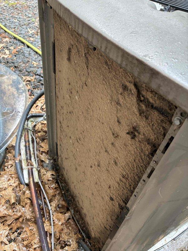 Responded to no cooling complaint on 8-year-old Lennox XC16 3-ton air conditioning system. Found condenser coil heavily plugged with debris and performed thorough coil cleaning. Discovered blower speed incorrectly set at 2000 CFM and adjusted to proper 1250 CFM for system tonnage. Inspected capacitor, contactor, and air filter—all found satisfactory. Measured temperature split and found poor performance; connected manifold gauges revealing abnormal pressure and temperature readings despite acceptable subcooling and superheat values. Diagnosed thermostatic expansion valve (TXV) stuck in wide-open position and not modulating properly. Added small refrigerant charge to test TXV response with no change in valve operation, confirming metering device failure. System currently providing marginal cooling but not operating at design efficiency. Provided part pricing for TXV replacement; homeowner elected to monitor system performance before authorizing repairs.