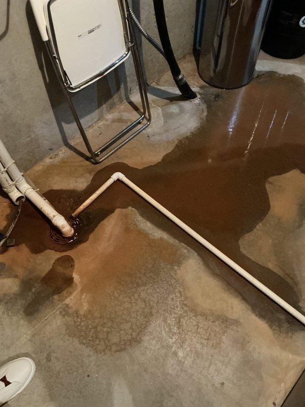 Responded to a floor drain backup in the mechanical room where standing water had accumulated across the concrete floor. Upon inspection, diagnosed the issue as debris from the water softener restricting drain flow and causing the backup condition. Utilized a flex shaft machine to clear all obstructing debris from the drain line. Following debris removal, flushed the system thoroughly with water to verify proper drainage function and confirm the floor drain was operating correctly with no further backup issues.