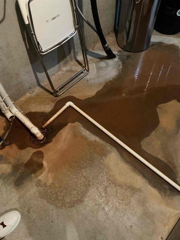 Responded to a floor drain backup in the mechanical room where standing water had accumulated across the concrete floor. Upon inspection, diagnosed the issue as debris from the water softener restricting drain flow and causing the backup condition. Utilized a flex shaft machine to clear all obstructing debris from the drain line. Following debris removal, flushed the system thoroughly with water to verify proper drainage function and confirm the floor drain was operating correctly with no further backup issues.