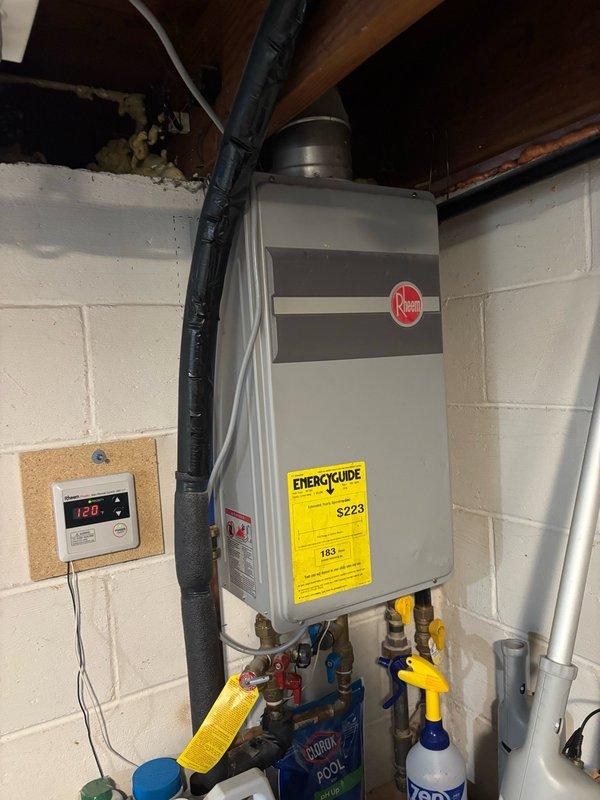 Performed comprehensive inspection on Rheem tankless water heater serving as the primary heating component for both domestic water and air systems. Conducted visual examination of unit exterior, confirming no visible leaks, damage, or areas of concern. Initiated startup procedure to verify operational functionality, listening for irregular sounds and monitoring performance parameters, which indicated proper operation.

Upon consultation with homeowner, determined unit had never been descaled since installation. Executed complete descaling procedure using appropriate chemical solution to remove mineral buildup from heat exchanger and internal components. Connected descaling pump and circulated descaling agent through the system per manufacturer specifications to restore optimal heat transfer efficiency and extend equipment lifespan.

Following descaling process, performed thorough system flush to remove residual descaling solution and loosened mineral deposits. Verified all plumbing con