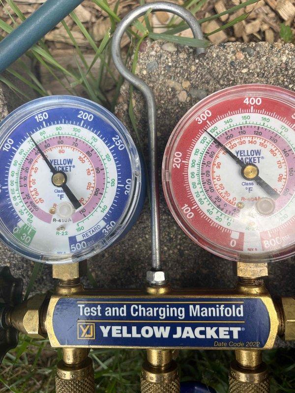 Responded to no cooling complaint on residential air conditioning system. Upon arrival, found 1.5 ton unit running continuously without achieving setpoint temperature. Performed diagnostic evaluation using manifold gauges to check system pressures and operation. Investigation revealed that the system has been operating continuously since occupancy began approximately nine years ago. Property has undergone significant renovations and additions, expanding the conditioned space to approximately 1900-2400 square feet. Assessment determined that the existing 1.5 ton capacity is severely undersized for the current square footage of the home, resulting in inability to adequately cool the space and continuous runtime. System is functioning mechanically but lacks sufficient capacity to meet the cooling load demands of the expanded living area. Recommended system replacement with properly sized equipment to match current home dimensions and cooling requirements.