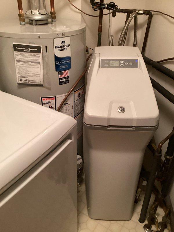 Responded to service call for water softener malfunction where salt level was not decreasing after regeneration cycles. Upon inspection, identified a salt bridge formation in the brine tank preventing proper salt dissolution. Broke up the salt bridge using manual methods to restore proper salt flow and system operation. Verified water softener unit returned to normal functioning with proper salt consumption during regeneration cycle.