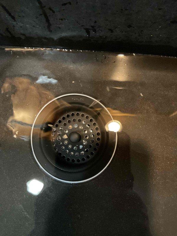 Completed no-charge callback to install customer-supplied basket strainer and replace dishwasher tailpiece at kitchen sink. Removed existing drain assembly and installed new strainer with proper sealing, ensuring secure mounting through sink basin. Replaced inadequate dishwasher tailpiece with correct-length component and verified all tubular drain fittings met proper extension requirements for leak-free connections. Tested complete drainage system under running water to confirm no blockages or slow-draining issues present. All connections secured and system returned to full operation.